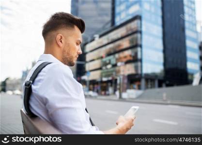 people, technology, communication and lifestyle - happy smiling young man with and bicycle sitting on city bench