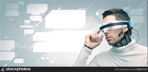 people, technology, future and progress - man with futuristic 3d glasses and microchip implant or sensors over gray background and blank virtual screens