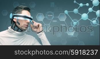 people, technology, future and progress - man with futuristic 3d glasses and microchip implant or sensors over gray background and molecules with chemical formulas