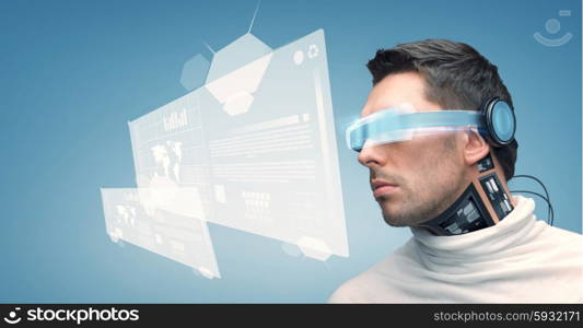 people, technology, future and progress - man with futuristic glasses and microchip implant or sensors over blue background and virtual screens