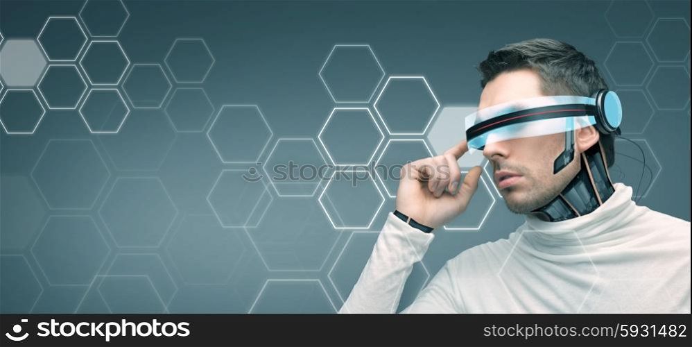 people, technology, future, network and progress - man with futuristic 3d glasses and microchip implant or sensors over blue background with hexagonal structure