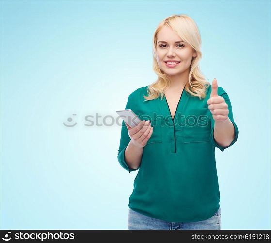 people, technology, gesture, communication and leisure concept - happy young woman with smartphone texting message over blue background