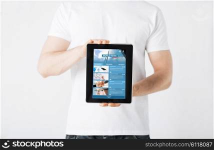 people, technology, mass media and internet concept - close up of man with business news on tablet pc computer screen