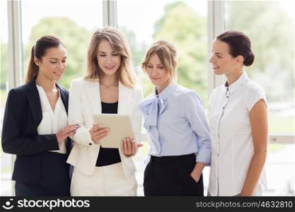 people, technology, work and corporate concept - business team of women with tablet pc computer at office