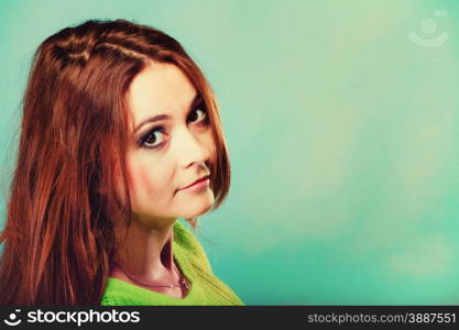 People teenage concept. Portrait young fashion woman teen girl wearing vivid colour sweater on blue