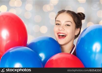 people, teens, holidays and party concept - happy smiling pretty teenage girl with helium balloons over holidays lights background