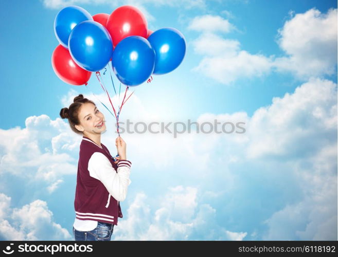 people, teens, holidays and party concept - happy smiling pretty teenage girl with helium balloons over blue sky and clouds background