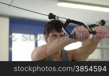 People training in fitness club, gym and sport activities. Young man exercising with weights, strong athlete with wellness equipment. Sequence, 11of27