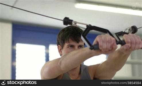 People training in fitness club, gym and sport activities. Young man exercising with weights, strong athlete with wellness equipment. Sequence, 11of27