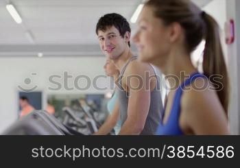 People training in fitness club, gym and sport activity. Young man working out and running on treadmill, portrait of happy male athlete with wellness equipment. 4of27