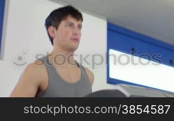 People training in fitness club, gym and sport activity. Young man working out and running on treadmill, male athlete with wellness equipment. 5of27