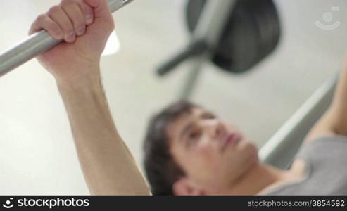 People training in fitness club, gym and sport activity. Young man exercising with weights, strong male athlete with wellness equipment. 9of27