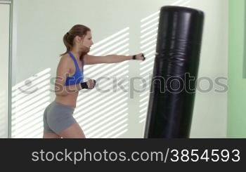 People training in fitness club, gym and sport activity. Pretty young woman working out, boxing and kicking, exercising for self-defense. 10of27
