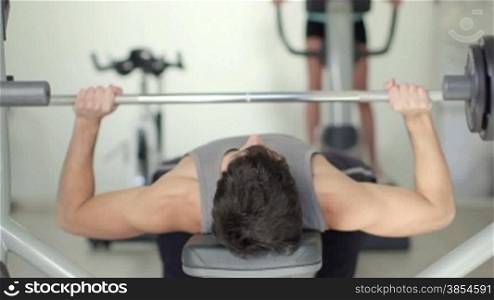 People training in fitness club, gym and sports activity. Young man working out with weight, strong athlete with wellness equipment. Sequence, 8of27