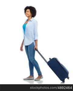 people, travel, tourism and vacation concept - happy afro american young woman with carry-on bag over white