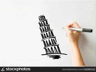 people, travel, tourism, graphic arts and architecture concept - close up of hand with marker drawing leaning tower of pisa sketch on white board or paper
