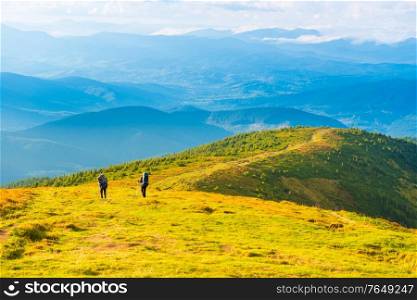 People travelling in mountains, mountain landscape with group of people
