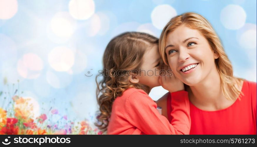 people, trust, love, family and motherhood concept - happy daughter whispering gossip to her mother over blue lights and poppy field background