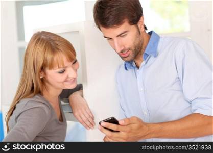 People using smartphone in office
