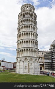 People visiting the Leaning Tower of Pisa in Tuscany, one of the most recognized buildings in the world.