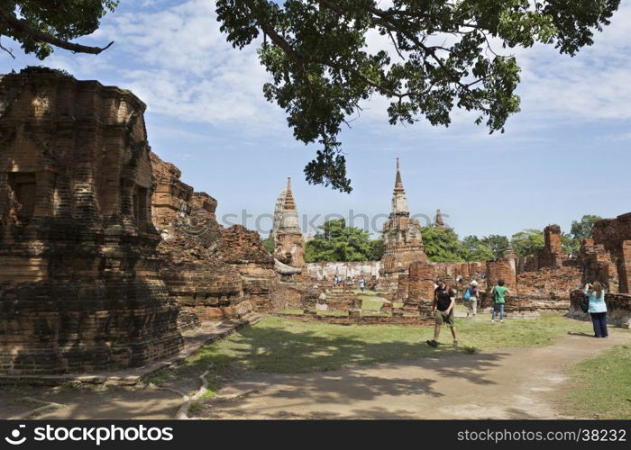 People visiting the Wat Mahathat temple complex in Ayutthaya, central Thailand