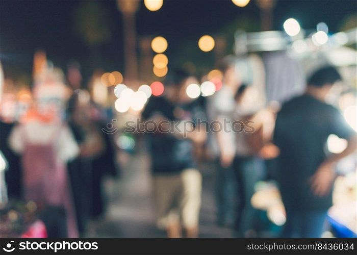 People walking at Festival Event Party night and bokeh Blurred Background.