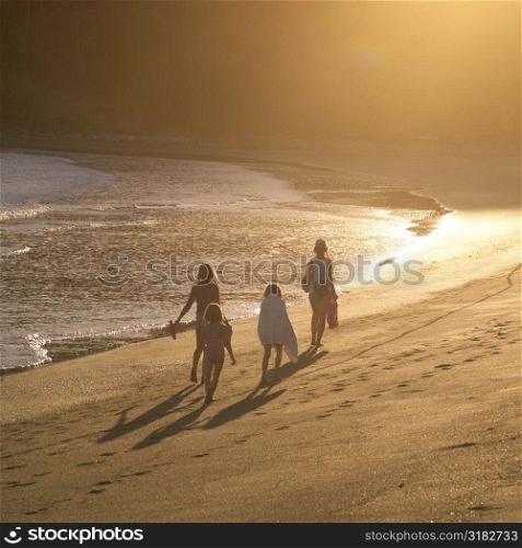 People walking down beach in Costa Rica