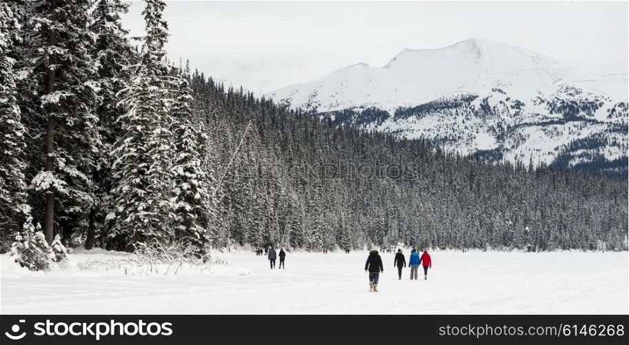 People walking in deep snow, Lake Louise, Banff National Park, Alberta, Canada