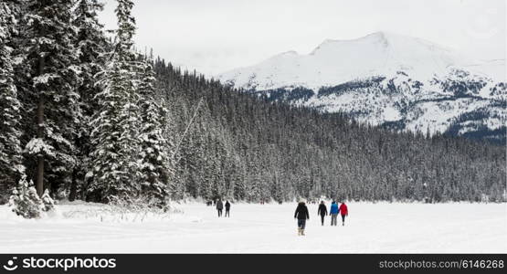 People walking in deep snow, Lake Louise, Banff National Park, Alberta, Canada