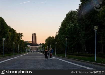 People walking on the main alley of Carol Park in Bucharest, Romania, 2021