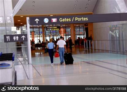 People walking towards gates at modern internation airport
