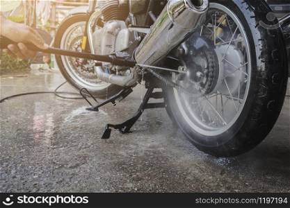 people wash cleaning motorcycle at home
