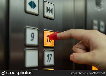 People wear finger shield when pressing the button in the elevator for touch protection against epidemic flu covid19 or corona virus with fear emotion in concept illness, outbreak, healthcare in life. People use finger shield pressing button elevator