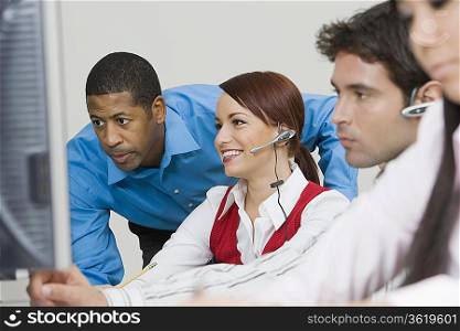 People Wearing Headsets in Office