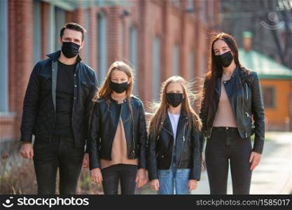 People wearing protective medical masks for prevent virus Covid-19. Family protect themself against Coronavirus and gripp. Family wearing masks to protect against Coronavirus and gripp