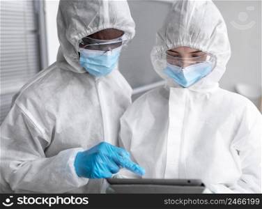 people wearing protective suit biohazard area 2