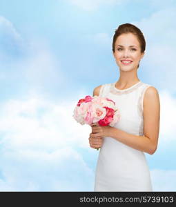 people, wedding, holidays and celebration concept - smiling bride or bridesmaid in white dress with bouquet of flowers over blue cloudy sky background