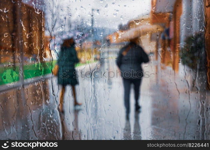 people with an umbrella in rainy days, autumn season, in Bilbao city, Basque country, Spain