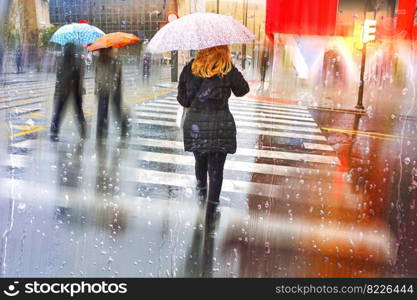 people with an umbrella in rainy days, autumn season, in Bilbao city, Basque country, Spain