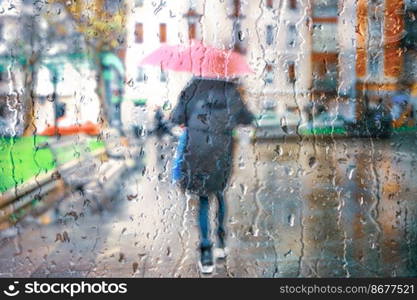 people with an umbrella in rainy days in Bilbao city, basque country, spain