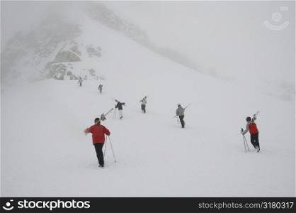 People with ski equipment