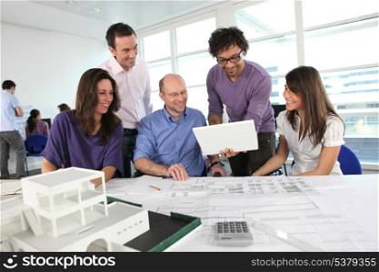 People working in an architect&rsquo;s office
