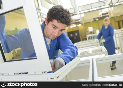 People working in window factory