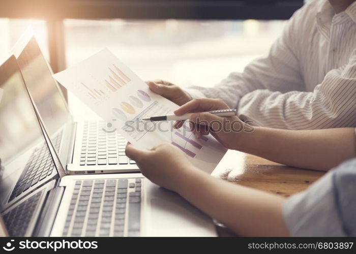 people working together with laptop computer, selective focus and vintage tone