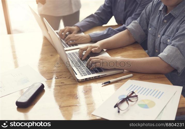 people working together with laptop computer, selective focus and vintage tone