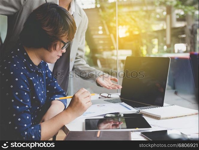 people working with document and laptop computer for use as office workplace concept