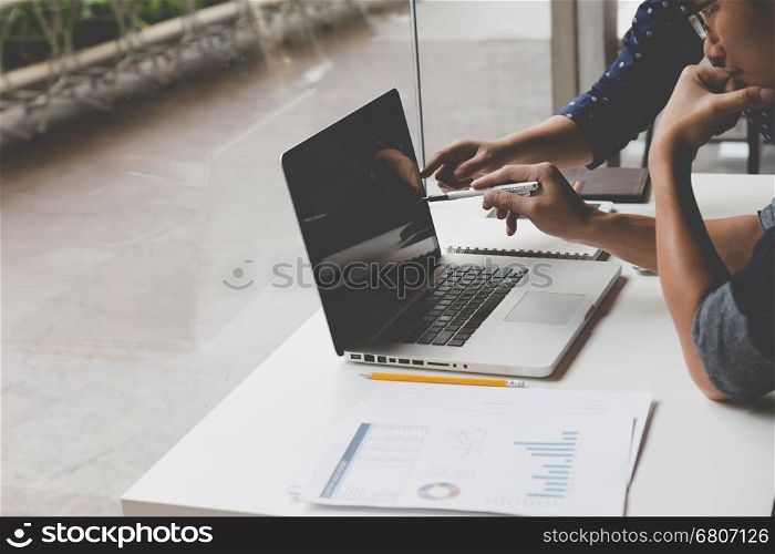 people working with document and laptop computer for use as office workplace concept