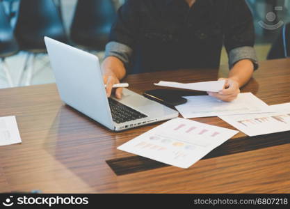 people working with document and laptop computer in office workplace - blur for background