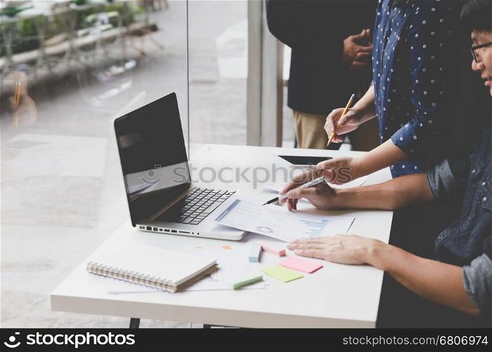 people working with document and laptop computer - meeting in office workplace concept