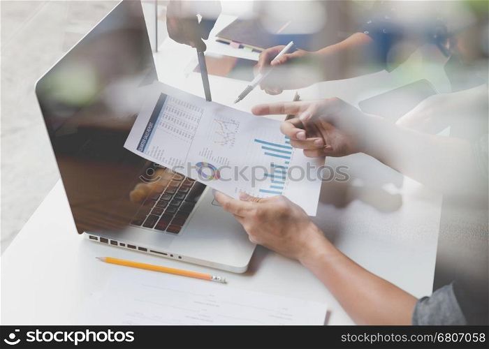 people working with document and laptop computer - meeting in office workplace concept